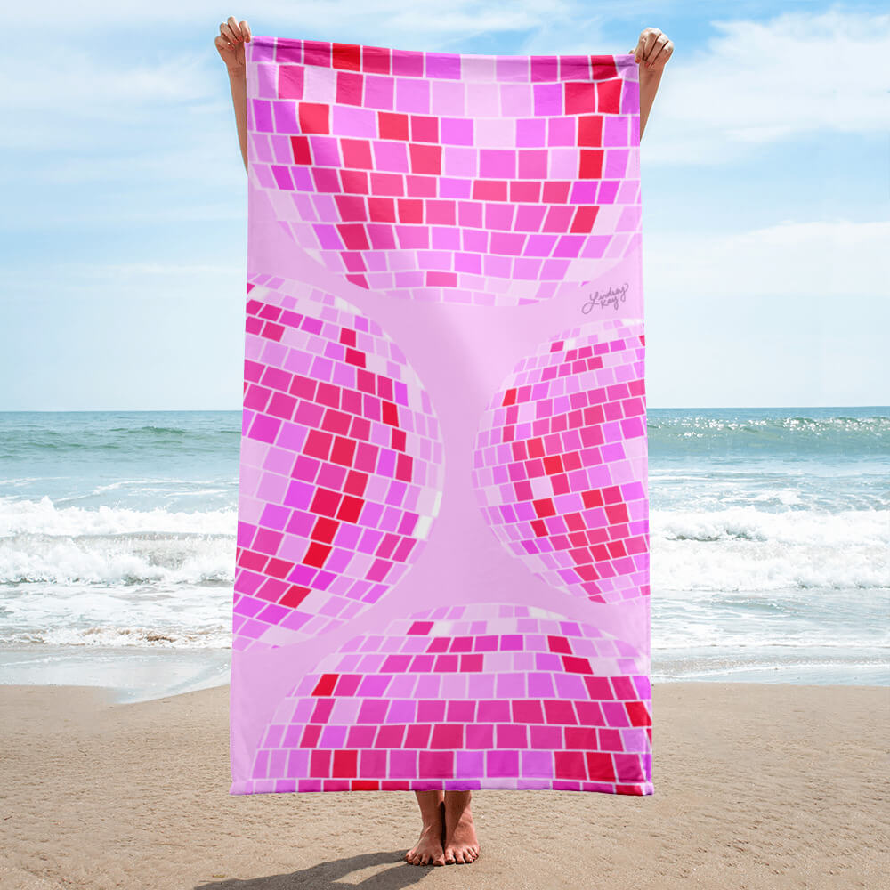Pink retro disco ball beach towel with hand-drawn design by Lindsey Kay Collective. Aesthetic pool towel for summer beach days, bachelorette gifts, and trendy pink-loving girls. 30x60 soft cotton polyester towel with retro pink vibes.